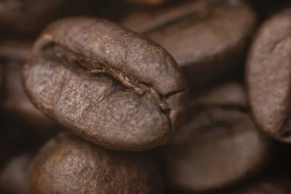 Coffee beans background. Coffee seeds pattern texture. Black morning coffee beans. Coffee concept.