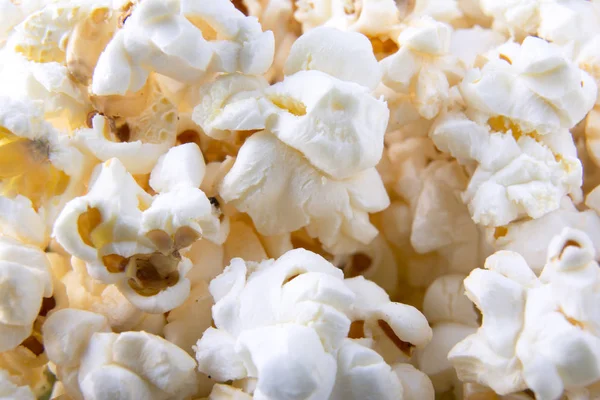Pozadí popcorns. Pohled shora. Close-up. Makro fotografie popcornu — Stock fotografie