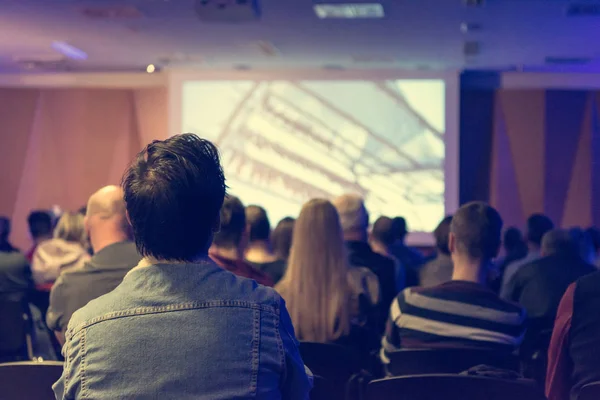 People listening to presentation at indoor conference. — Stock Photo, Image