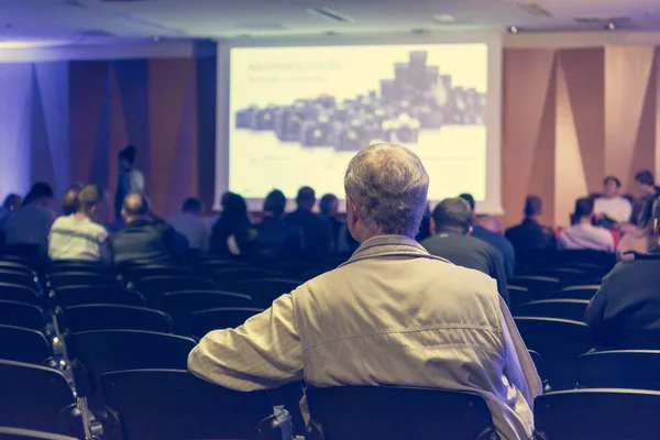 People listening to presentation at indoor conference. — Stock Photo, Image