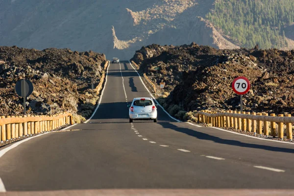 Road running through arid volcanic wasteland On Tenerife. — Stock Photo, Image