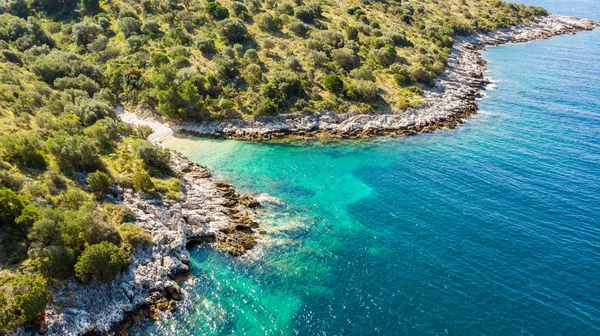 Spectacular aerial sea landscape of rocky coast and crystal clear water.