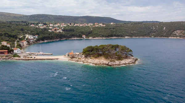 Spectacular aerial landscape with fishing village near peninsula stretching into the sea. — Stock Photo, Image