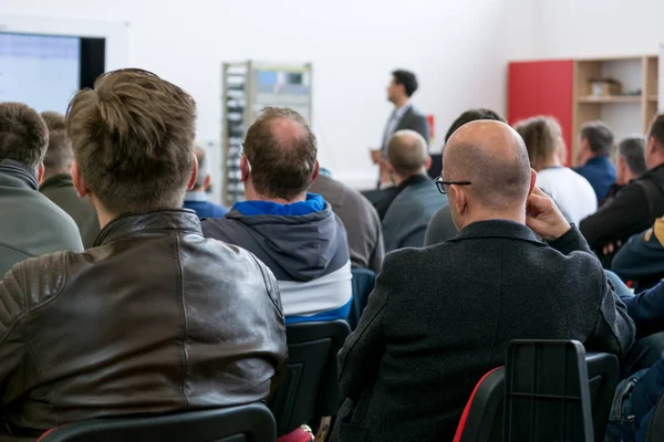 Audience at business presentation listening to person giving a speach. — Stock Photo, Image