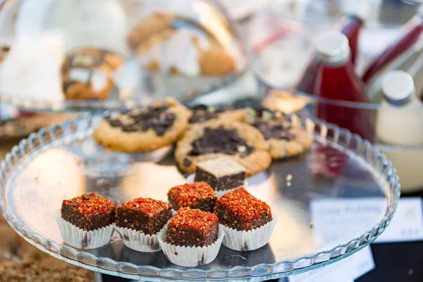 Delicious finger food deserts sold at outdoor market place.