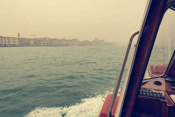 Venice in winter fog - view from taxi boat driving tourists. — Stock Photo, Image