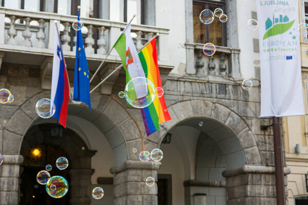 Ljubljana, Slovenia - June 17, 2016: Many bubbles floating infront of city hall in sign of support of equal rights movement