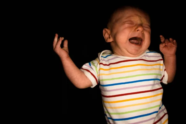 Baby Hayden op zwart op twee maanden oud Stockfoto