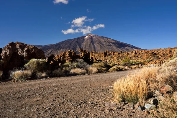 El Teide, Spain\'s highest mountain on teneriffa, faces the viewer with its white chimney, above it a very blue sky