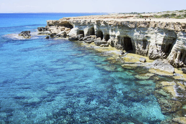 Sea caves in the high cliffs