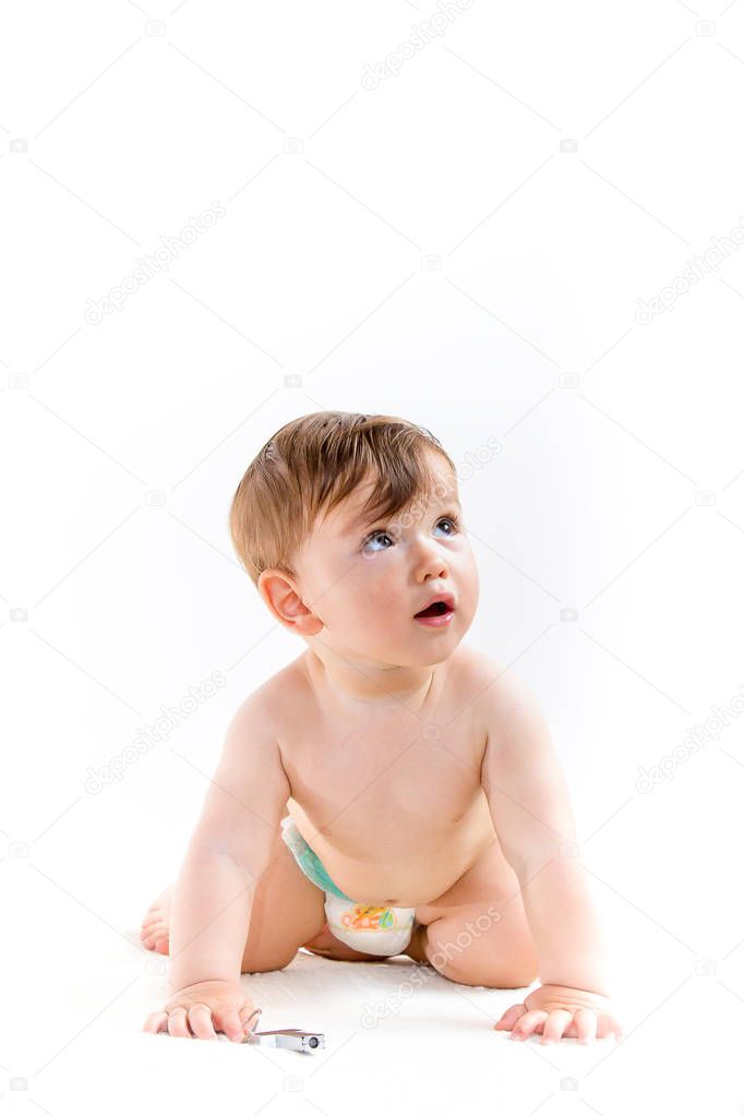 Portrait of cute, little chubby baby boy in diapers isolated on white background