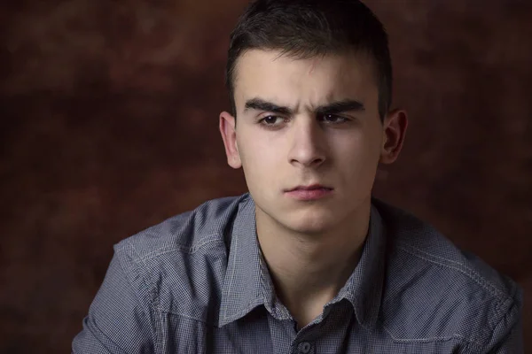 Young man thinking about something. Trying to remember. Body language — Stok fotoğraf