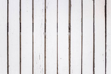 Yakın çekim beyaz ahşap dikey plakalar. Ahşap çit, arka plan, doku