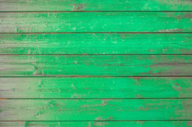 Ahşap arka plan doku yeşil boya kısmen plakaları kapsayan.
