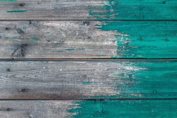 Деревянная текстура фона синяя краска частично покрывающая доски . — стоковое фото