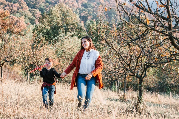 Boy Playing Plane Toy Park His Mom Running Field — Stock Photo, Image