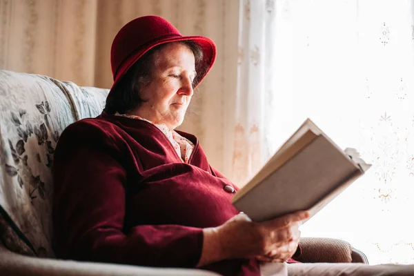 Elderly Woman Hat Reading Book Window — Stock Photo, Image