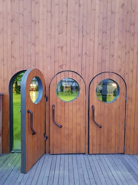 Three Identical Standing Side Side Brown Wooden Doors Windows One — Stock Photo, Image