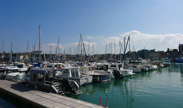 The port of Dieppe, sea, yachts and fishing boats on a sunny autumn day