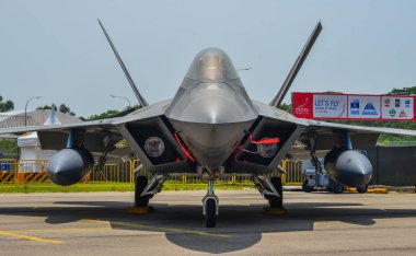 Singapore - Feb 10, 2018. Lockheed Martin F-22 Raptor aircraft belong to the US Air Force sits on display in Changi, Singapore. clipart