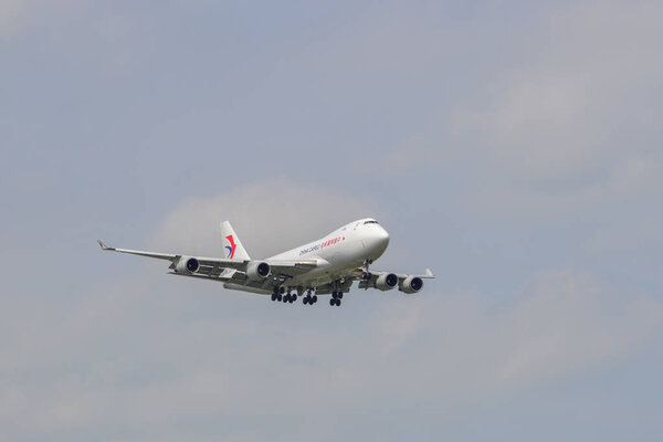 Passenger airplane landing at Bangkok Airport