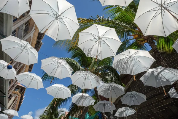 White umbrellas urban street decoration