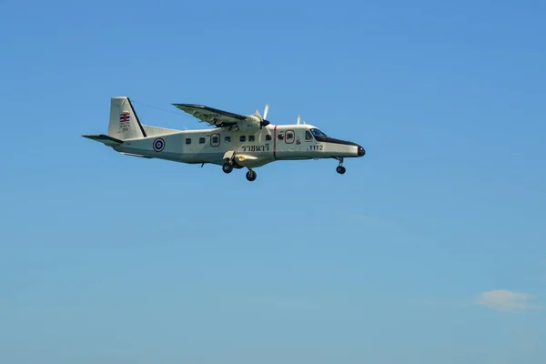 stock image Phuket, Thailand - Apr 4, 2019. Royal Thai Navy Dornier Do-228 (reg. 1112) landing above the sand beach near Phuket Airport (HKT).