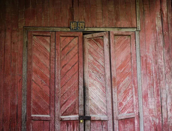 Rustic wooden door of rural house — Stock Photo, Image