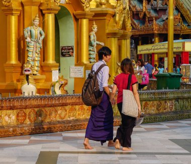 Prayers visit the Shwedagon Pagoda  clipart