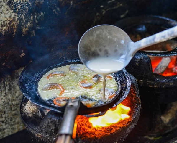 Cooking Vietnamese traditional seafood pancake