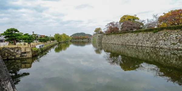 Moat of Himeji Castle in autumn