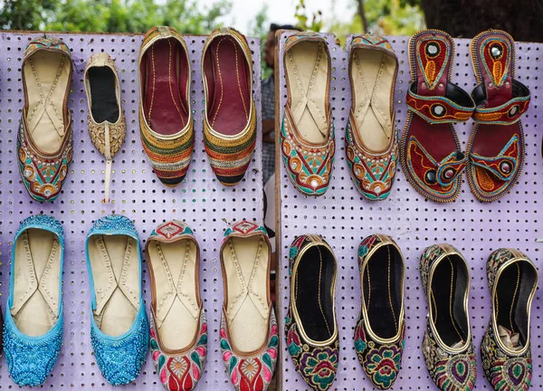 Colorful oriental ethnic shoes on flea market — Stock Photo, Image