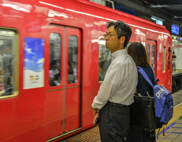 Passengers waiting for the train at JR Station — Stock Photo, Image