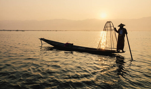 Man catching fish on Inle Lake (Shan State)