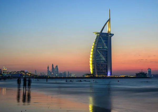 Burj Al Arab Hotel with the beach at sunset Royalty Free Stock Images