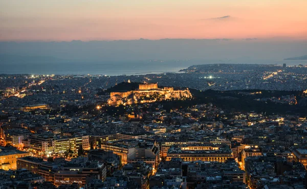 Night scene of Athens, Greece. Athens skyline at night viewed from Mount Lykavitos with Acropolis Hill.