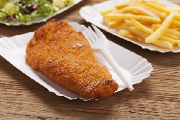 Fried fish and chips on a paper tray