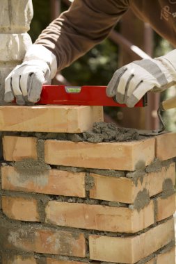 leveling the masonry bricks clipart