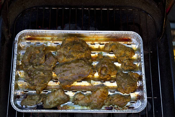 Grilled pork on a tray in the garden — Stock Photo, Image