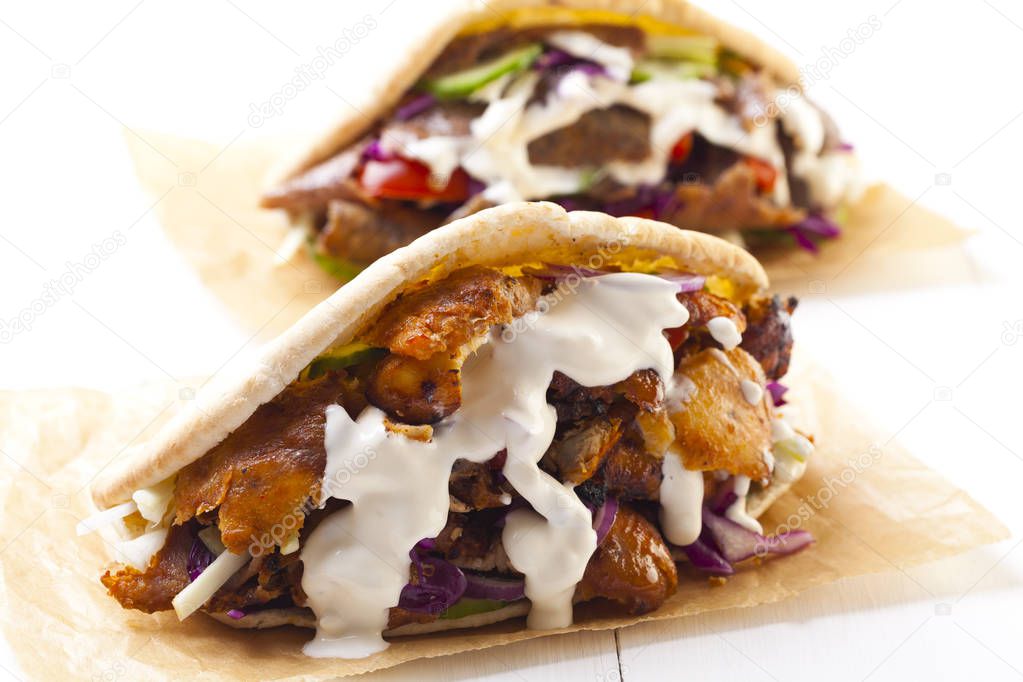 Kebab in a bun with garlic sauce