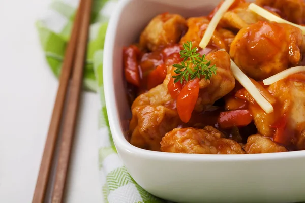 Fried chicken pieces in batter with sweet and sour sauce