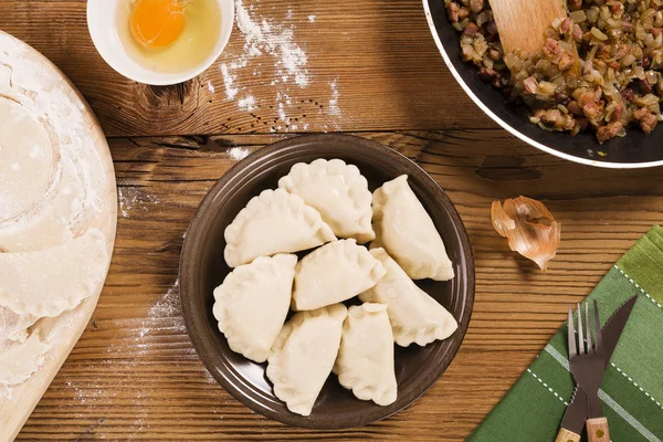 Preparing homemade dumplings with onion and bacon — Stock Photo, Image