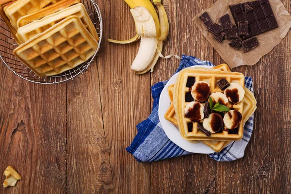 Delicious waffles with banana and chocolate — Stock Photo, Image