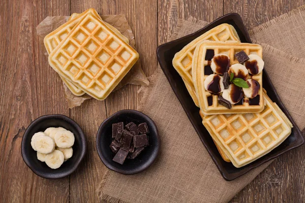 Delicious waffles with banana and chocolate — Stock Photo, Image