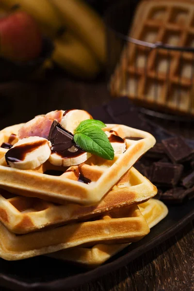 Delicious waffles with banana and chocolate — Stock Photo, Image