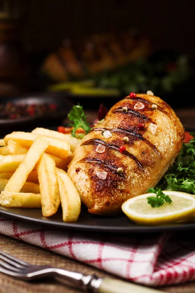 Grilled Chicken Breast Green Salad French Fries Black Plate — Stock Photo, Image