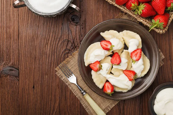 Delicious Dumplings Fresh Strawberries Served Whipped Cream Sugar Dark Wooden — Stock Photo, Image