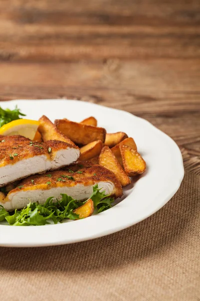 Chicken Schnitzel Served Roasted Potatoes Salad Front View Natural Wooden — Stock Photo, Image