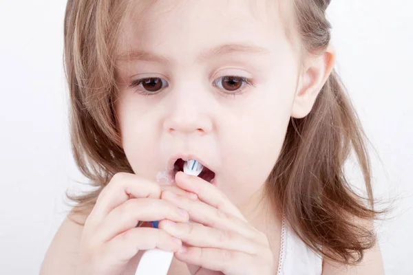 Cute Little Girl Brushing His Teeth Stock Image