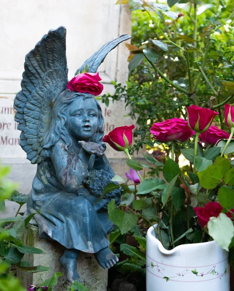 More than 100 years old statue. Cemetery located in Rome.